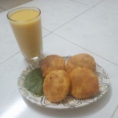 A picture of Peas Kachori with Mango Milk shake.