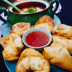 A picture of Fried_wontons with hot and sour soup.
