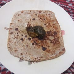 A picture of Namak ajwain ka Parantha with aam ka achar.
