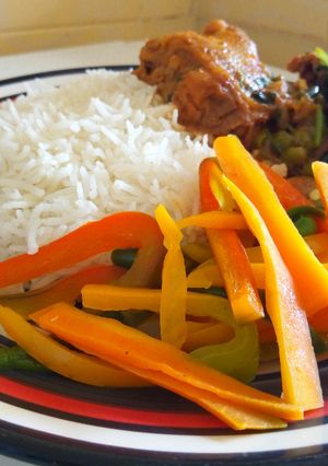 A picture of Coconut Chicken Served With Rice and Stir-Fry Vegetables.
