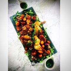 A picture of Butterflied Rosemary+Sage Roast Chicken And Cajun Season+Thyme Roasted Sweet Potatoes.