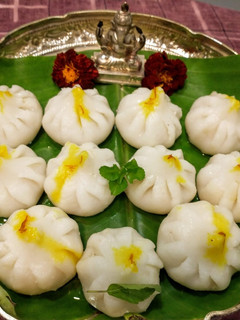 A picture of Steamed Modak (Sweet coconut dumplings).