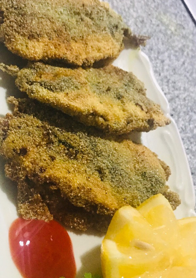 Una foto de Sardinas rellenas con una salsa especial 🐟(manera marroquí)