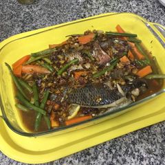 A picture of Saucey Steamed Thilapia  with Vegetables.