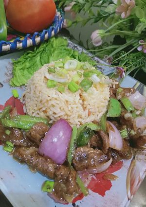 A picture of Dry Beef chilli with garlic rice.
