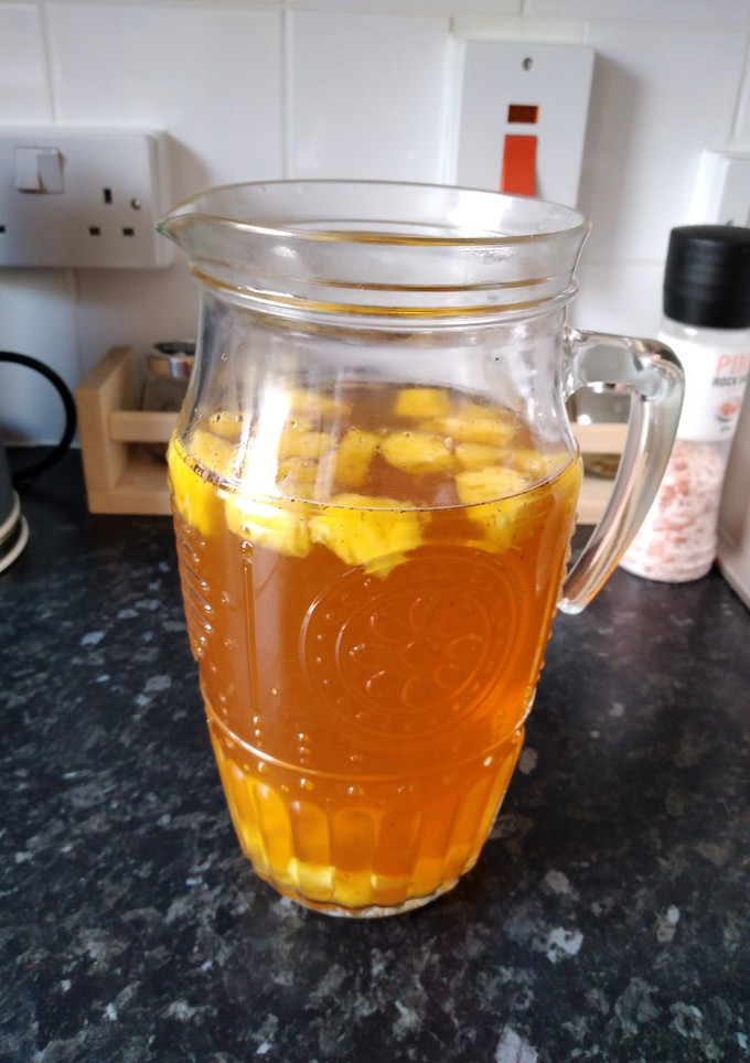 Una foto de Earl grey tea frío con piña, bebida súper refrescante