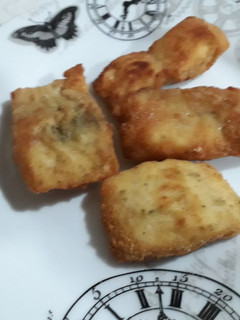 Una foto de Filetes de merluza empanados