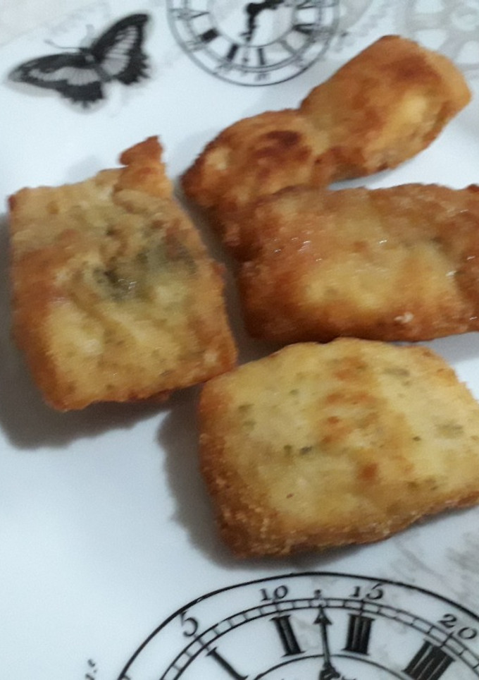 Una foto de Filetes de merluza empanados