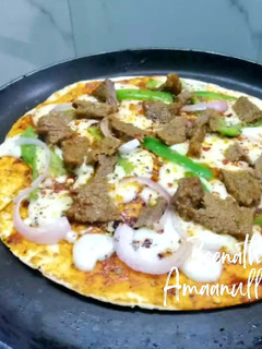 A picture of Tortilla Non Veg Pan Pizza.