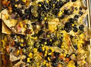 A picture of nachos with spicy beans
