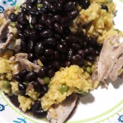 A picture of Black Beans Yellow Rice and Chicken.