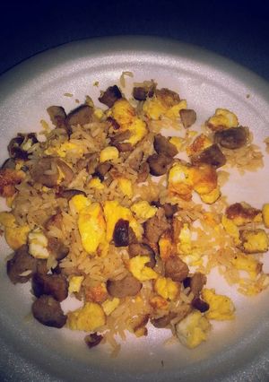 A picture of Hot rice with sausages and scramble eggs.