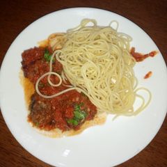 A picture of Meatballs in sauce.