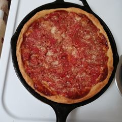 A picture of Chicago deep dish pizza.