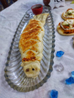 A picture of Chicken bread with leftover pizza dough.