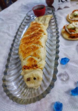 A picture of Chicken bread with leftover pizza dough.