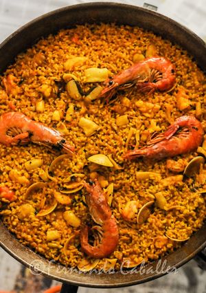 A picture of Paella with Prawns.