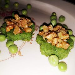 Green peas sweet delight with honey glazed walnuts A picture of Green peas sweet delight with honey glazed walnuts.