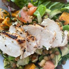 A picture of Grilled chicken and green lentil salad.