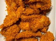 Una foto de filetes de pollo freidora de aire