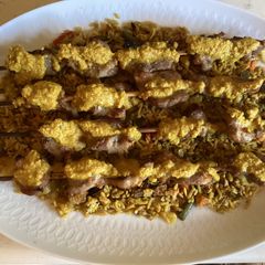 A picture of California Farm Pork Skewers in Peanut Sauce.