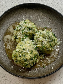 A picture of Spinatknödel with Parmesan (Spinach Dumpling).
