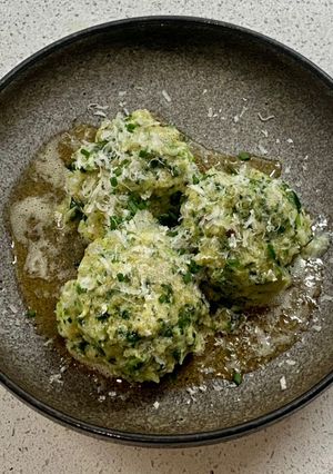 A picture of Spinatknödel with Parmesan (Spinach Dumpling).