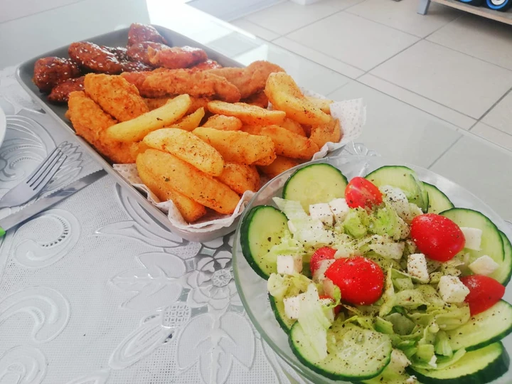 Recipe Fried chicken strips, potato wedges and a light green salad which Delicious