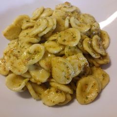 A picture of Fresh orecchiette pasta with sun dried tomato pesto.