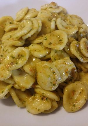 A picture of Fresh orecchiette pasta with sun dried tomato pesto.