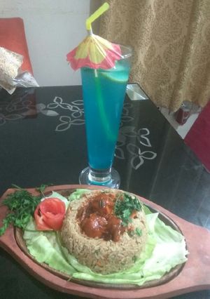 A picture of Vegetables fried rice with Manchurian.