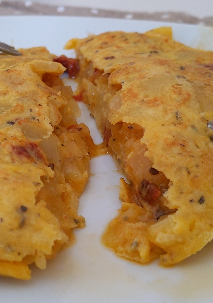 Una foto de Tortilla de patata con Tomate seco y parmesano