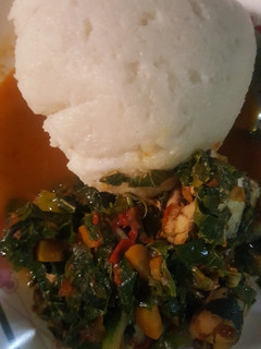 A picture of Tuwon shinkafa wif vegetable soup spinach.