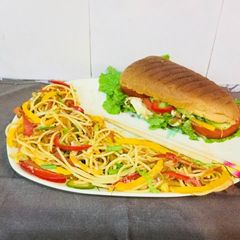 A picture of Subway Style Sandwitch WithSpaghetti.