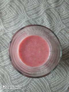 A picture of Pink strawberry and peanut smoothie.