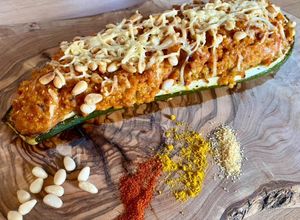 Une photo de Courgettes farcies au quinoa, parmesan et pignons