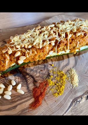 Une photo de Courgettes farcies au quinoa, parmesan et pignons