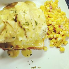 A picture of Crockpot Chicken & gravy & mashed potatoes on Texas bread.