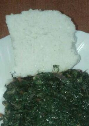 A picture of Its dinner time.... Have some ugali and kales.