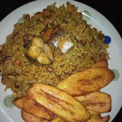 A picture of Okpehie rice with fish and plantains.