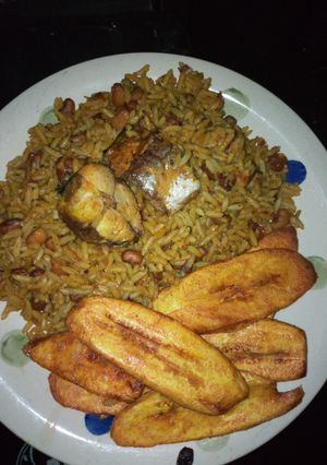 A picture of Okpehie rice with fish and plantains.