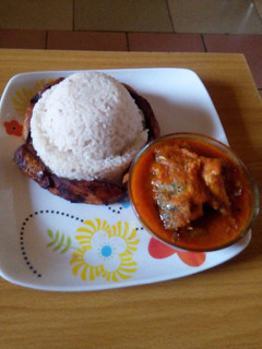 A picture of White rice,fish stew and dodo.