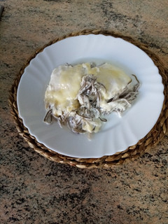Una foto de Bacalao con gulas al horno