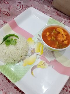 A picture of Chicken shashlik gravy with garlic zeera fried rice.