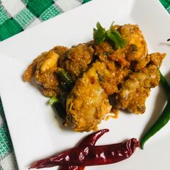 A picture of Spicy red chili chicken karahi.