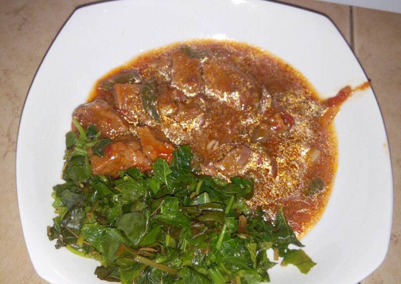 Boiled mchicha and beef stew..