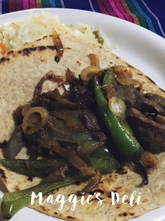 Una foto de Tacos de hígado encebollado