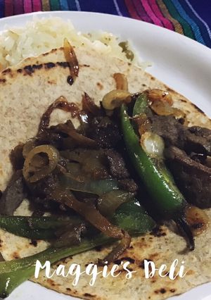 Una foto de Tacos de hígado encebollado