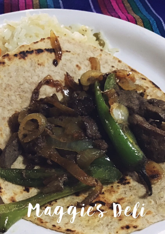 Una foto de Tacos de hígado encebollado
