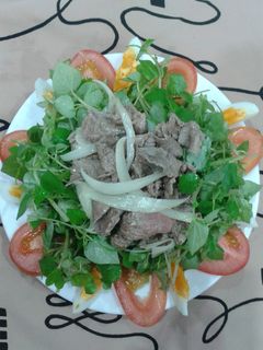 Hình của món Rau càng cua trộn thịt bò.